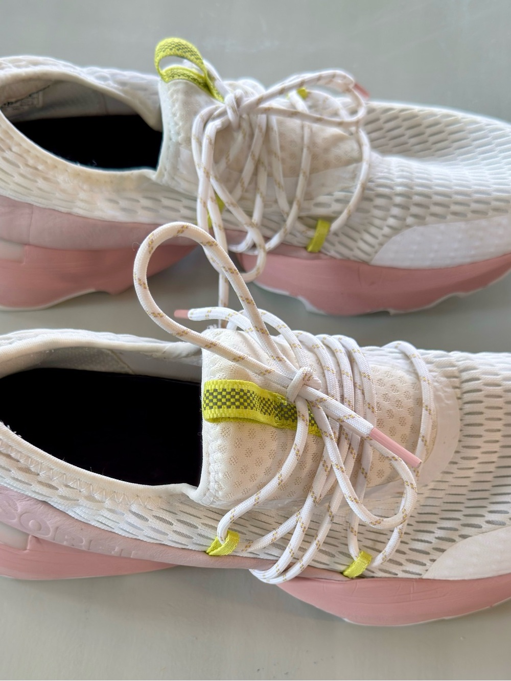 Sorel Women's Kinetic Impact White Sneakers with Pink Sole and Yellow Accents